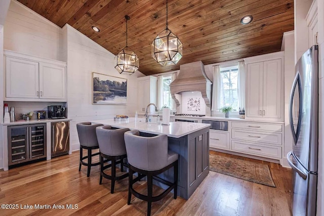 326 Bulgers Mill Loop, Alexander City, AL 35010 - kitchen featuring freestanding refrigerator, beverage cooler, wood ceiling, lofted ceiling, and premium range hood