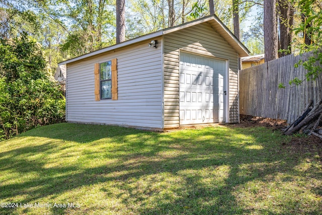 garage with a lawn