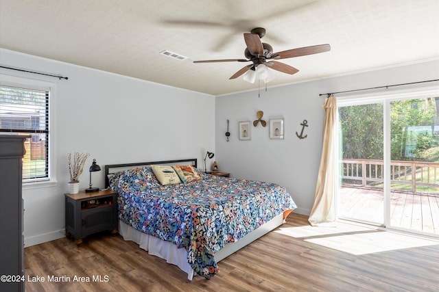 bedroom featuring ceiling fan, ornamental molding, and hardwood / wood-style flooring