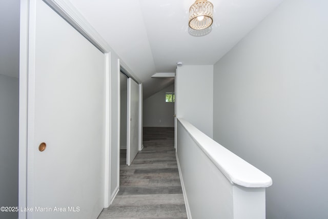 1706 Simpson St, Alexander City, AL 35010 - hall featuring wood finished floors, lofted ceiling, and a chandelier