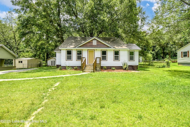 1706 Simpson St, Alexander City, AL 35010 - view of front of house featuring crawl space and view of wooded area