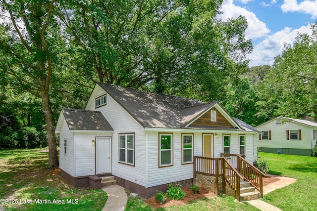 1706 Simpson St, Alexander City, AL 35010 - bungalow featuring a front yard, a metal roof, entry steps, and crawl space