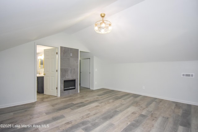 1706 Simpson St, Alexander City, AL 35010 - bonus room featuring lofted ceiling, wood finished floors, and a premium fireplace