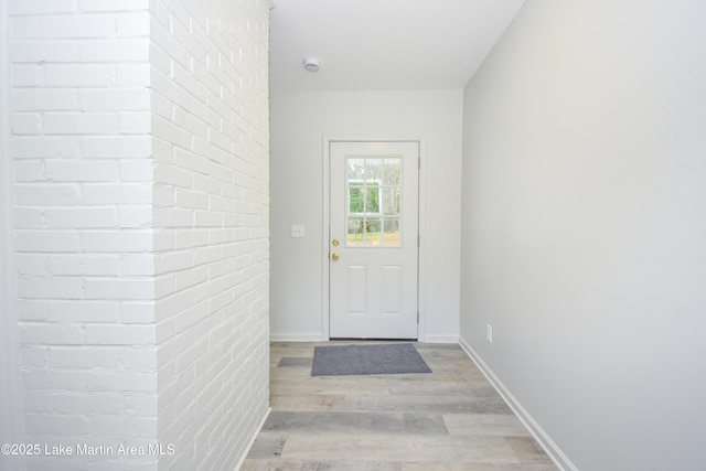 1706 Simpson St, Alexander City, AL 35010 - doorway to outside featuring light wood-style floors and baseboards