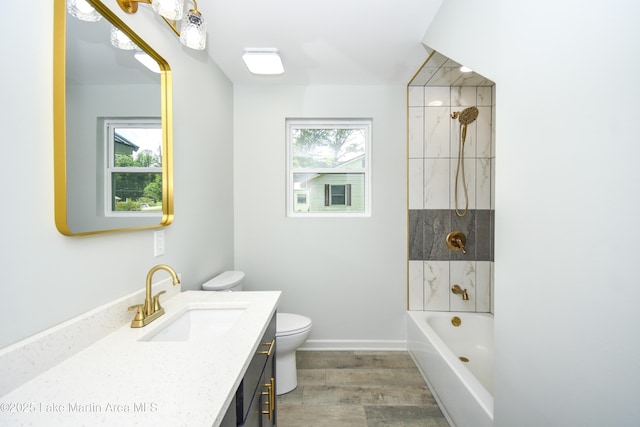 1706 Simpson St, Alexander City, AL 35010 - full bathroom featuring vanity, wood finished floors, and  shower combination
