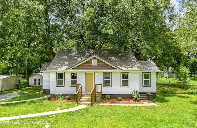 1706 Simpson St, Alexander City, AL 35010 - view of front of property with a metal roof and crawl space