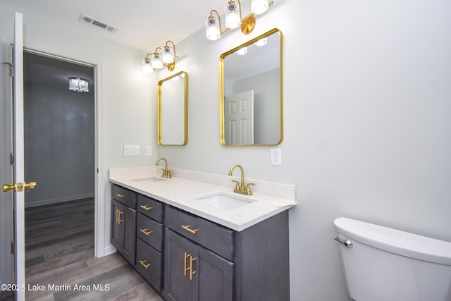 1706 Simpson St, Alexander City, AL 35010 - bathroom with wood finished floors and double vanity