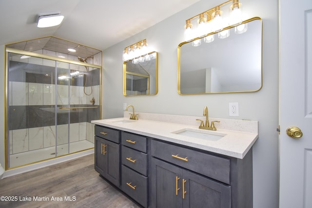 1706 Simpson St, Alexander City, AL 35010 - full bath with double vanity, a shower stall, and wood finished floors