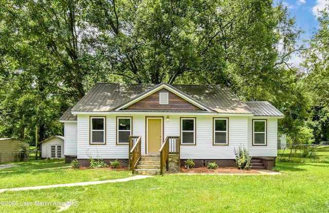 1706 Simpson St, Alexander City, AL 35010 - view of front facade featuring a metal roof and entry steps