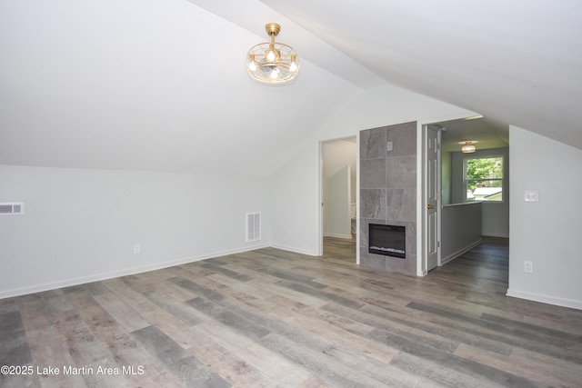 1706 Simpson St, Alexander City, AL 35010 - additional living space with wood finished floors, lofted ceiling, and a premium fireplace