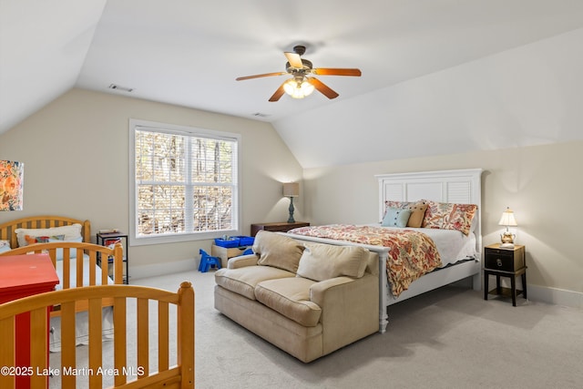 bedroom with vaulted ceiling, carpet flooring, and visible vents