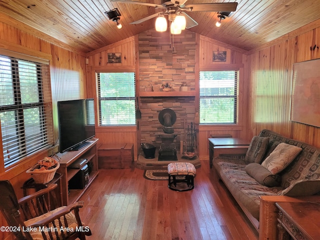 living room featuring wood walls, hardwood / wood-style floors, and wood ceiling