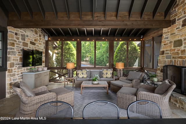 view of patio / terrace with an outdoor living space with a fireplace