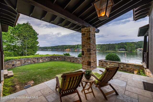 view of patio with a water view