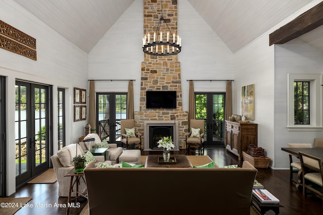 living room with a fireplace, french doors, high vaulted ceiling, and dark hardwood / wood-style floors