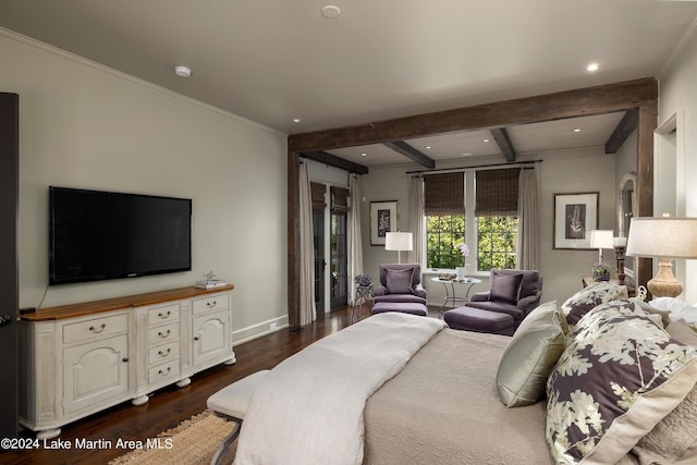 bedroom with beam ceiling and dark hardwood / wood-style floors