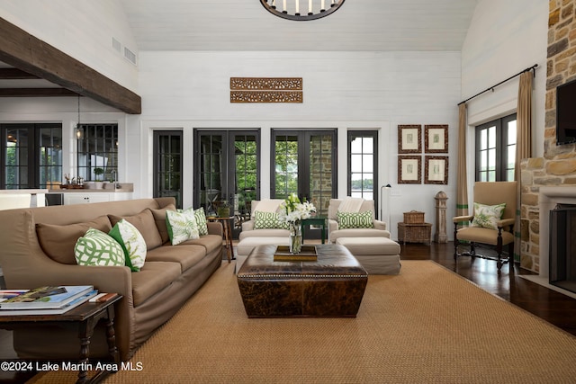 living room featuring french doors, hardwood / wood-style flooring, and high vaulted ceiling