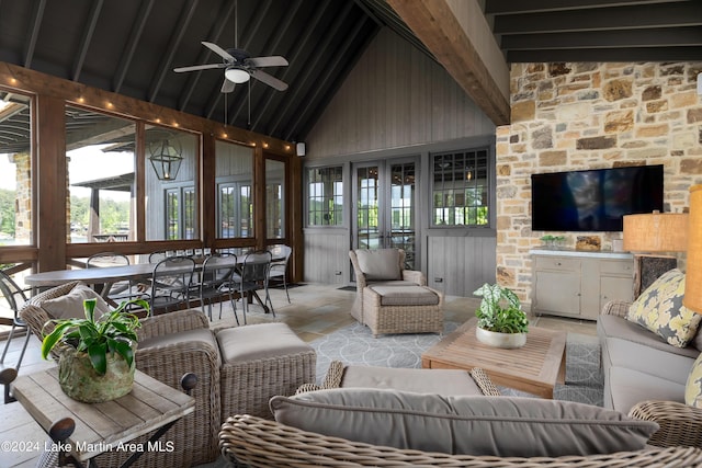 living room with beam ceiling, high vaulted ceiling, and ceiling fan