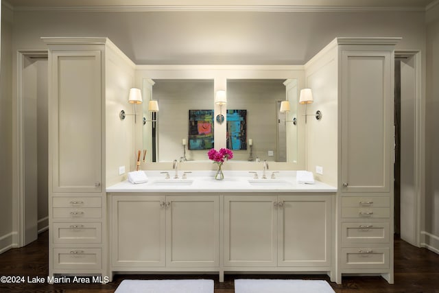 bathroom featuring vanity, wood-type flooring, and crown molding