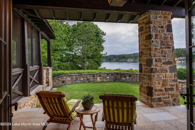 view of patio featuring a water view