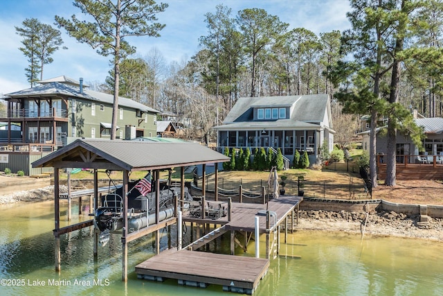 dock area with a water view and boat lift