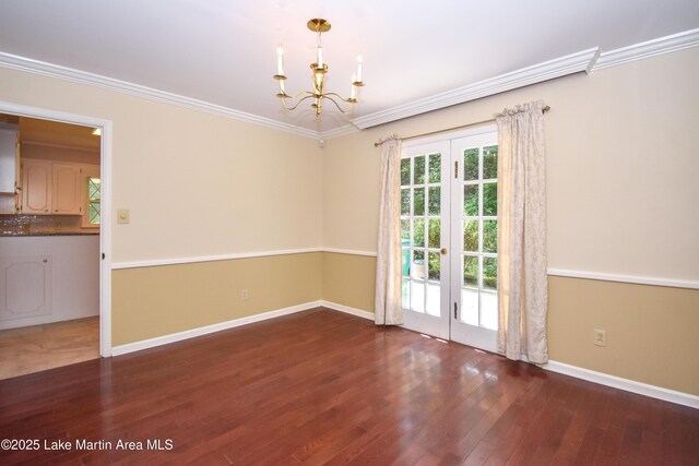 605 Noble Rd, Tallassee, AL 36078 - unfurnished bedroom featuring ornamental molding, baseboards, visible vents, and two closets