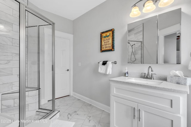 bathroom featuring vanity and a shower with shower door