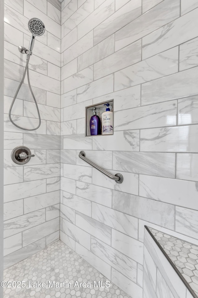 bathroom with tiled shower