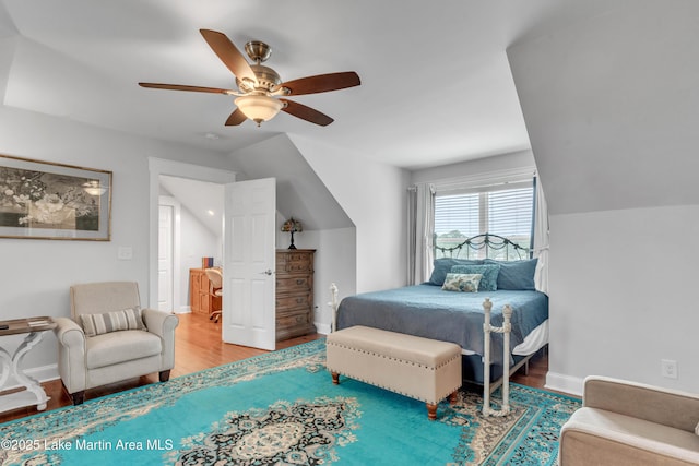 bedroom featuring vaulted ceiling, ceiling fan, and hardwood / wood-style floors