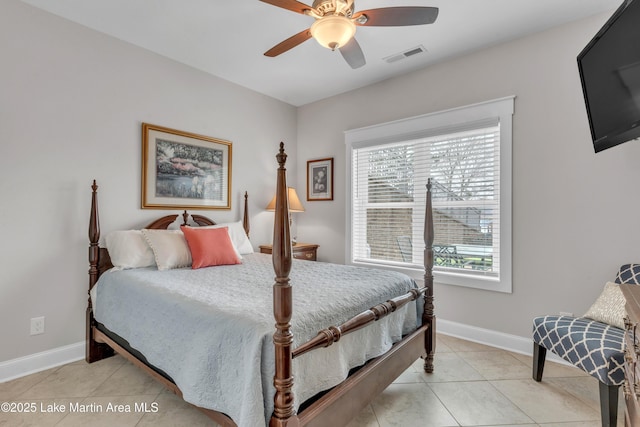 tiled bedroom with ceiling fan