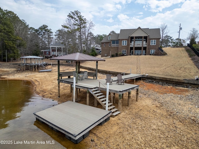 dock area featuring a gazebo and a water view