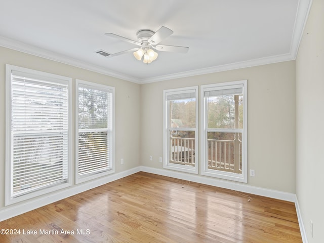 unfurnished room with ceiling fan, light hardwood / wood-style flooring, and ornamental molding