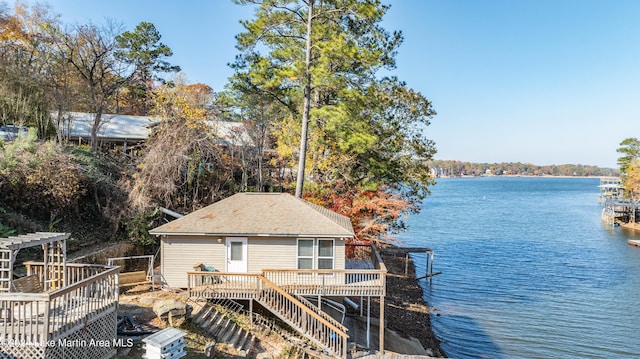 exterior space with a deck with water view