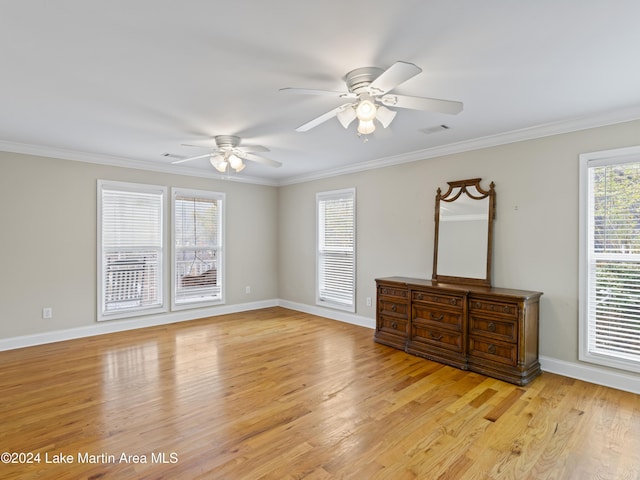 spare room featuring ceiling fan, light hardwood / wood-style flooring, and ornamental molding