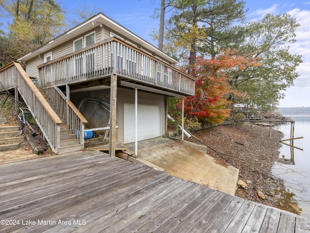 view of dock featuring a deck with water view