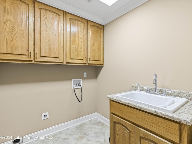 424 Weatherford Cir, Dadeville, AL 36853 - laundry area with cabinets, hookup for a washing machine, electric dryer hookup, sink, and light tile patterned floors