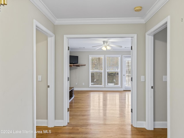 hallway featuring light hardwood / wood-style flooring and ornamental molding