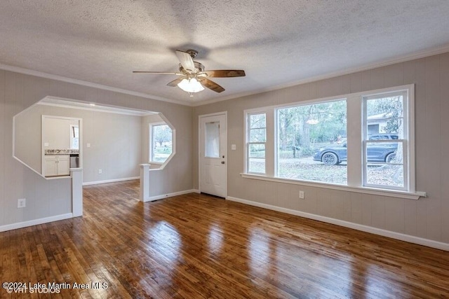 interior space featuring crown molding, dark hardwood / wood-style flooring, ceiling fan, and a textured ceiling