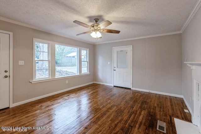 unfurnished room featuring ceiling fan, dark hardwood / wood-style flooring, a textured ceiling, and ornamental molding