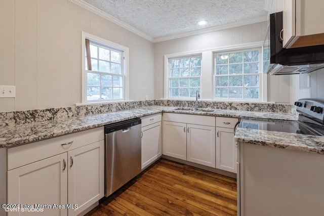 kitchen featuring a textured ceiling, sink, white cabinetry, and stainless steel appliances