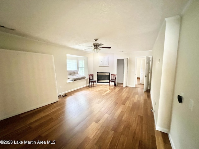 unfurnished living room with hardwood / wood-style floors and ceiling fan