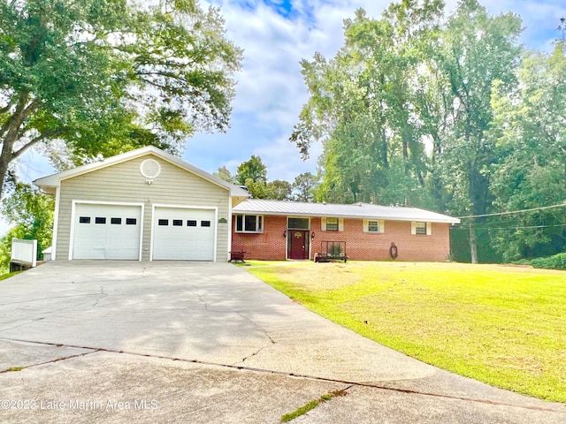 ranch-style home with a front yard and a garage