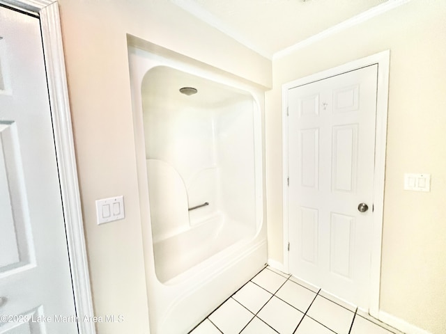 bathroom with tile patterned floors and walk in shower