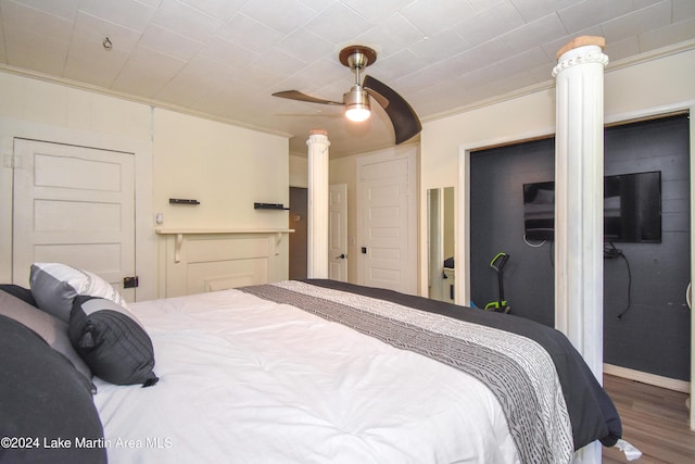 bedroom featuring ceiling fan, crown molding, and hardwood / wood-style flooring