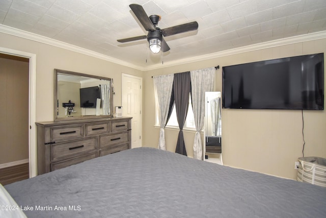 bedroom featuring ceiling fan and ornamental molding