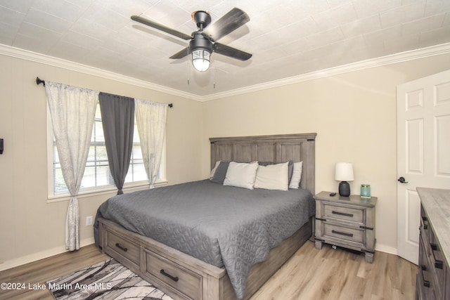 bedroom with ceiling fan, crown molding, and light wood-type flooring