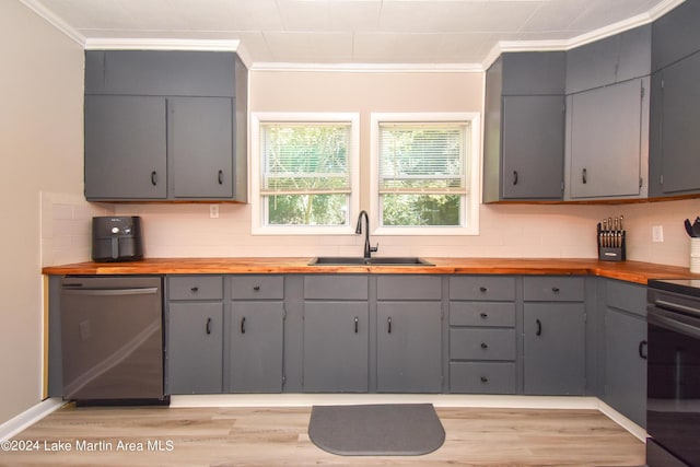 kitchen featuring crown molding, sink, gray cabinets, dishwasher, and butcher block countertops