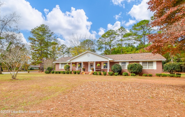 single story home with a porch