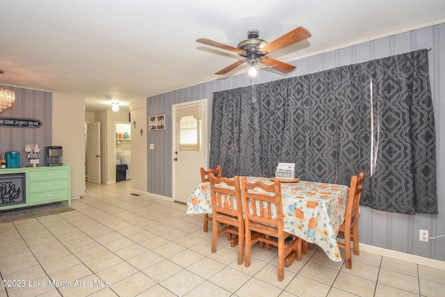 tiled dining area featuring ceiling fan