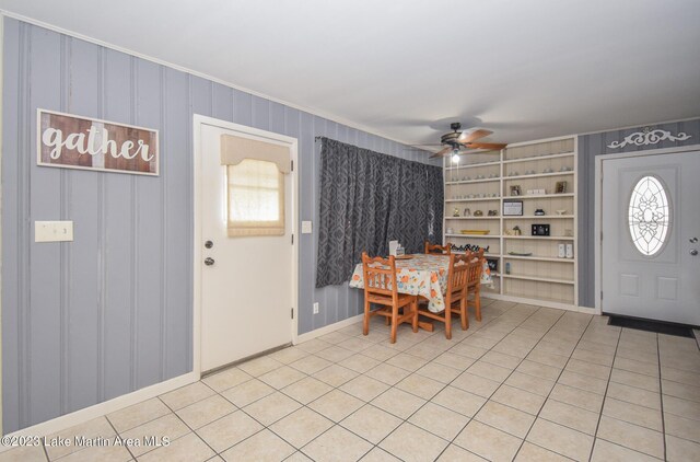 tiled foyer featuring a wealth of natural light and ceiling fan